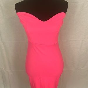 This is a size 4 strapless dress in the color pink.